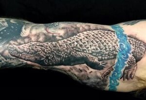 Detailed alligator skin tattoo