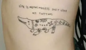 Feminine alligator tattoo