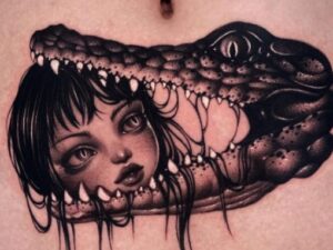 Girl head alligator tattoo
