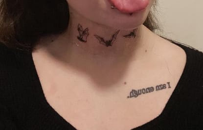 Bat neck tattoo