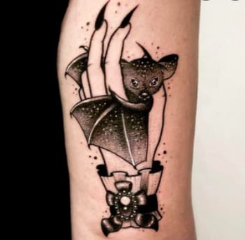 Finger cat wings tattoo