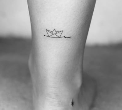 Paper Boat Lower Leg Tattoo