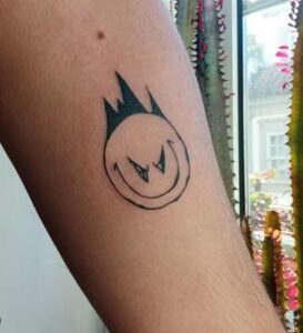Evil Smile Tattoo