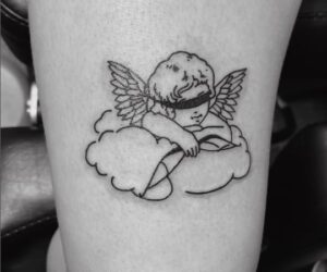 Above Knee Cupid Tattoo
