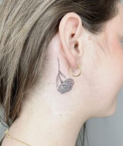 Behind The Ear Marigold Flower Tattoo