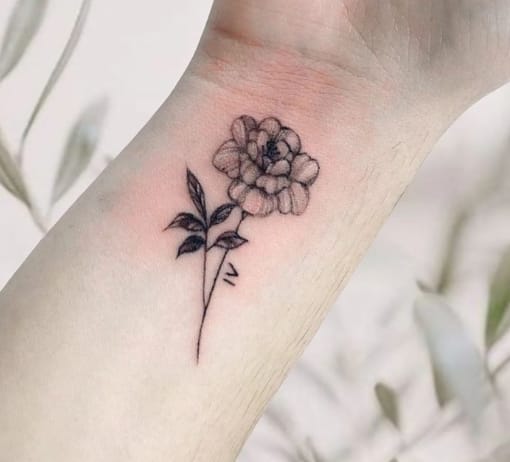 Black Inked Marigold Flower Tattoo