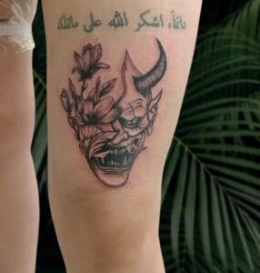 Above Knee Scary Tattoo