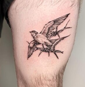Swallow Above Knee Tattoo