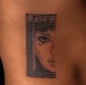 cleopatra half faced tattoo