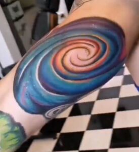 galaxy swirl tattoo