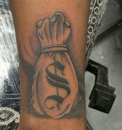 hand money bag tattoo