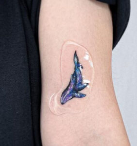 minimalist whale tattoo 3