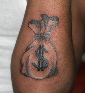 money bag arm tattoo