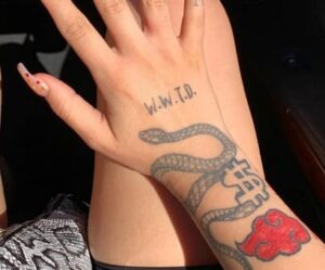 Kesha Dollar Sign Back of Hand Tattoo | Steal Her Style