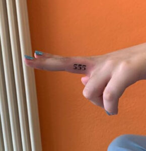 angel number finger tattoo