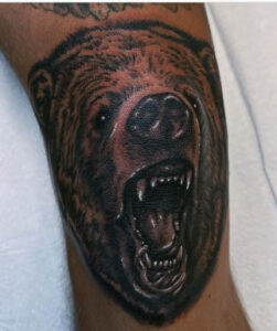 bear knee cap tattoo