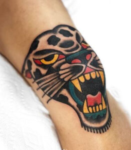 knee cap leopard tattoo