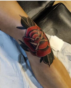 knee cap rose tattoo