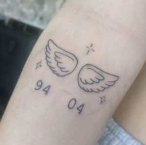 small angel number tattoo