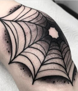 spider web knee cap tattoo