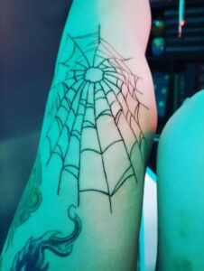 spider web knee cap tattoo 3