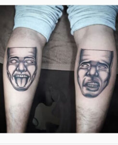two face leg tattoo