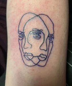 two face side tattoo