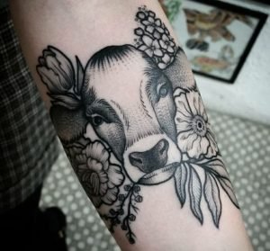 Black And White Cow Tattoo