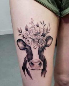 Black-Inked Floral Cow Tattoo