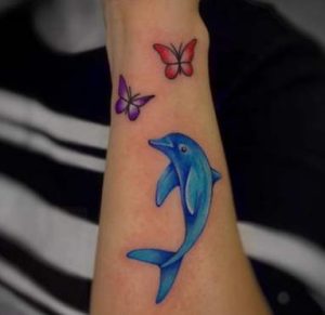 Dolphin tattoo with Butterflies