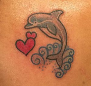 Dolphin tattoo with Heart and waves