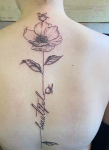 Spine Botanical Flower Tattoo
