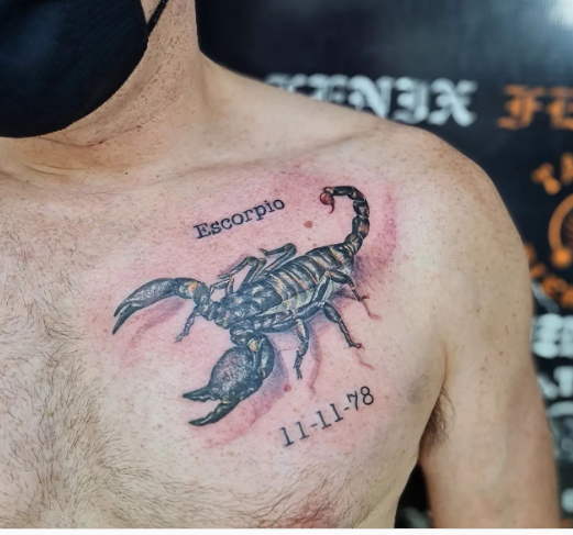 scorpion chest tattoo