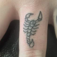 scorpion finger tattoo