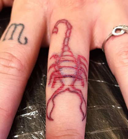 scorpion finger tattoo