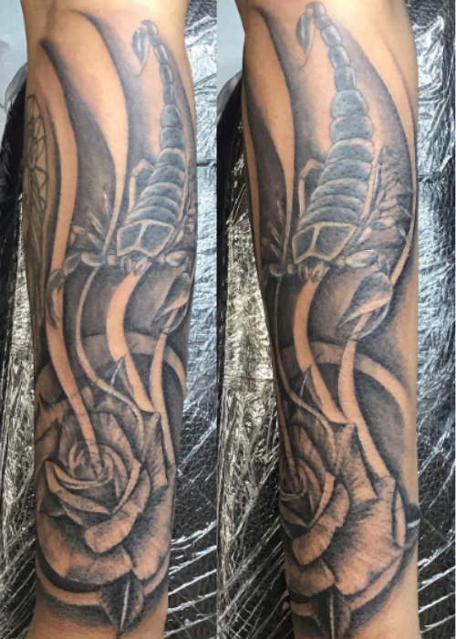 scorpion tattoo with flowers