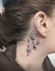 behind the ear floral tattoo