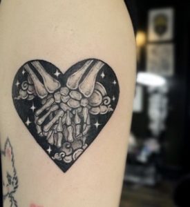 Skeleton Hands Touching Tattoo