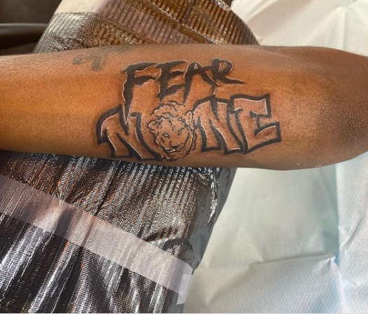 Fear None Arm Tattoo