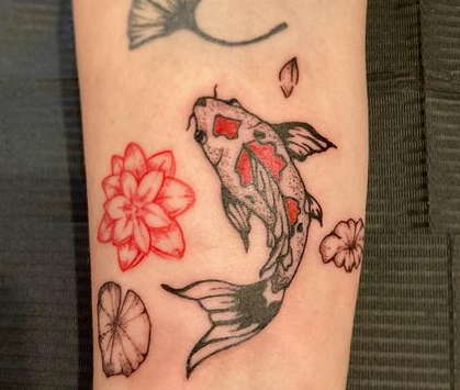 Koi fish with water lily tattoo