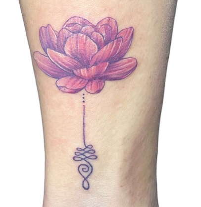 Purple water lily tattoo
