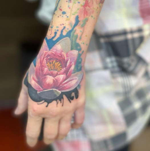 Realistic water lily tattoo