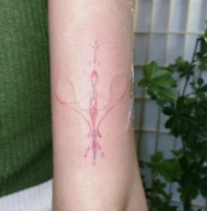 Womb Tattoo On Arm