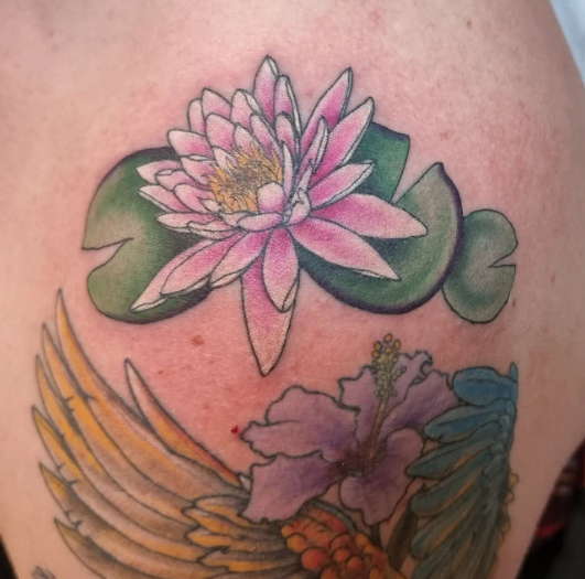 Simple water lily tattoo
