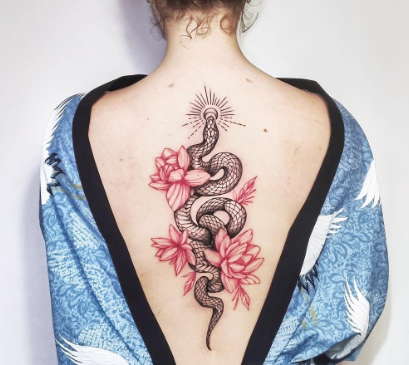 Snake and water lily tattoo