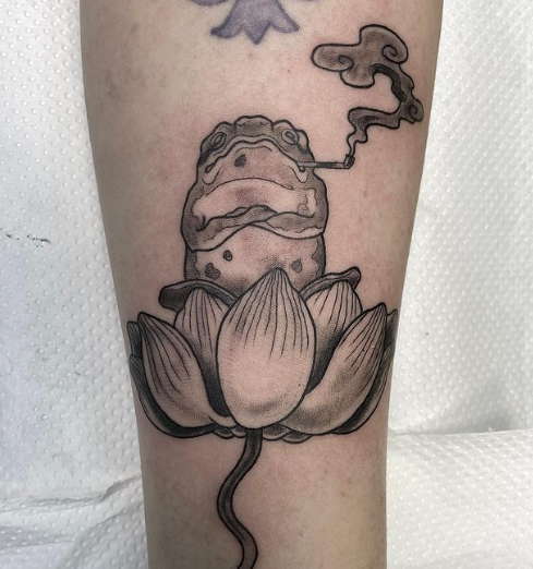 Water lily and a frog tattoo