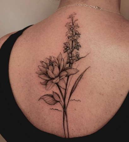 Water lily back tattoo