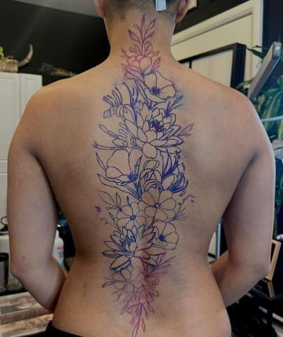 Water lily back tattoo