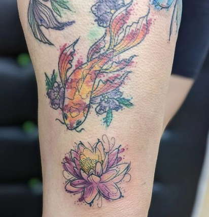 Watercolor water lily tattoo