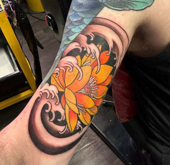 Yellow water lily tattoo